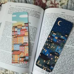 the bookmark is made out of paper and has an image of a city on it