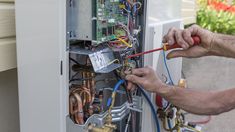 a man working on an electrical panel