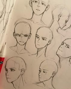 a pencil drawing of various heads and hair styles on paper with markers next to it