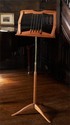 a small wooden music stand on a hard wood floor