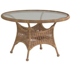 a wicker table with glass top on white background