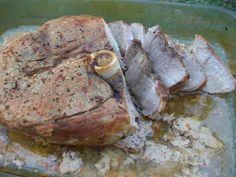 some meat is laying on top of some food in a pan and ready to be cooked