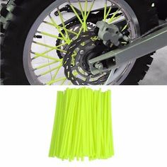 the wheels and spokes of a motorcycle are shown in this image with neon green paint