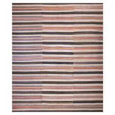 a multicolored rug with different stripes on it