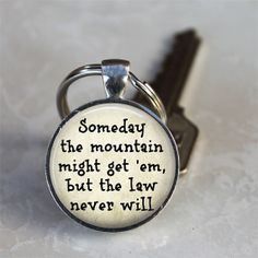 a keychain with a quote on it that says,'some day the mountain might get him, but the law never will