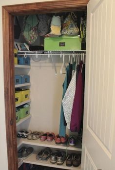 an open closet with shoes and other items