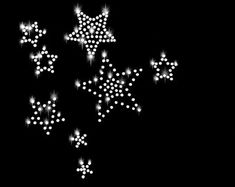 white stars are flying in the air on a black background