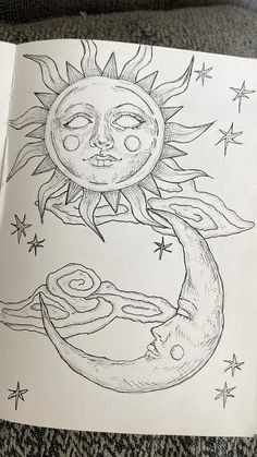 a drawing of the sun and moon with stars