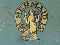 the mermaid logo is on the side of a building