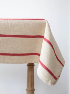 a close up of a table cloth on a wooden chair