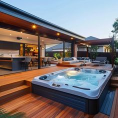 a hot tub sitting on top of a wooden deck