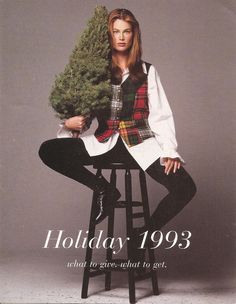 a woman sitting on top of a stool holding a christmas tree in her hand and the caption reads, holiday 1994 what to give what to set?