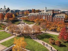 an aerial view of a campus with many trees and people walking on the walkways