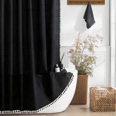 a black and white shower curtain in a bathroom