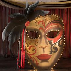 a carnival mask sitting on top of a wooden floor next to candles and a curtain