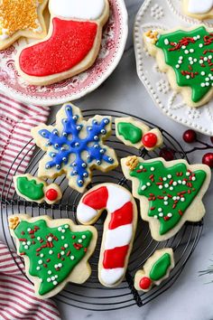 decorated cookies are displayed on a white tray