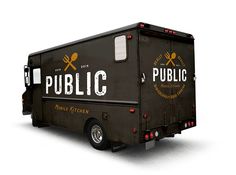 a black truck with the words public written on it's side is parked in front of a white background