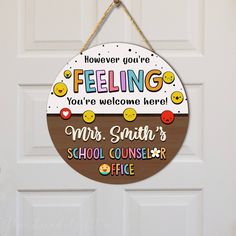 a hanging sign that says feeling you're welcome here, mrs smith school council office