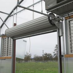 the inside of a building that has an open window and sliding glass door on it