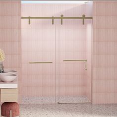 a bathroom with pink walls and tile flooring next to a walk in shower stall