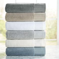 a stack of towels sitting on top of a counter