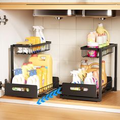 two black trays filled with cleaning products on top of a kitchen sink under a faucet