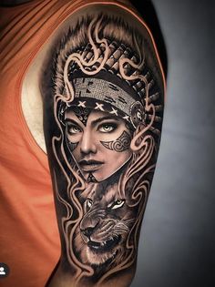 a woman with tattoos on her arm is holding a wolf and an eagle in her hand