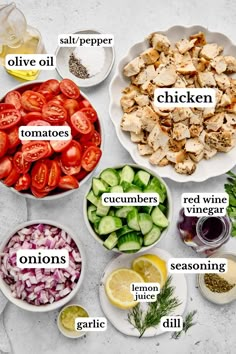 the ingredients to make chicken salad laid out on a white counter top, including tomatoes, cucumbers, onions, lemons, onion, dill and garlic