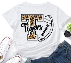 a t - shirt with the word tigers on it and a baseball in leopard print