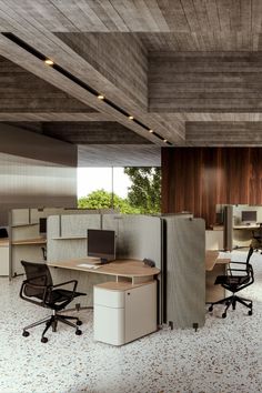 an office with two cubicles and several chairs