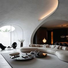 a living room filled with lots of white furniture