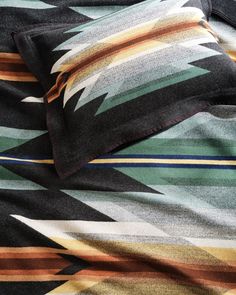 an image of a blanket that has been made with multicolored stripes on it