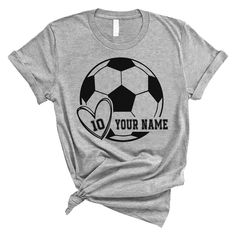 PRICES MAY VARY. PERSONALIZED T-SHIRT: A personalized Soccer T-shirt with name and shirt number will be the perfect gift for soccer lovers, mom, daughter, sister, niece, Wife, girlfriend,... Click on "Customize Now" and and start designing your unique shirt. MATERIAL: Solid colors are 100% cotton ( Black, White, Navy , Forest Green). Dark Heather colors are 50% cotton, 50% polyester. Sport Grey and Athletic Heather 90% cotton, 10% polyester. Color Dark Gray Heather and Heather Mauve 52% cotton, Custom Sports Shirts, Sports Parent, Dark Heather Color, Game Day Shirts, Soccer Shirts