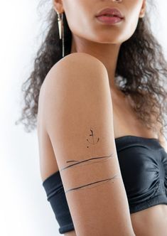 a woman with a tattoo on her arm