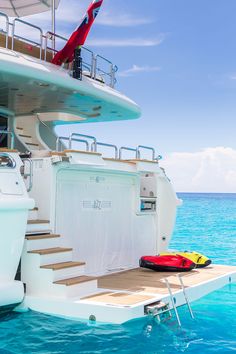 a boat that is in the water with stairs leading up to it's deck