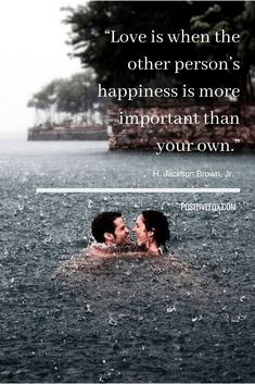 two people swimming in the water with a quote above them that says love is when the other person's happiness is more important than your own