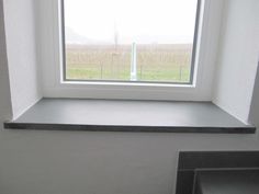 an empty window in a white room