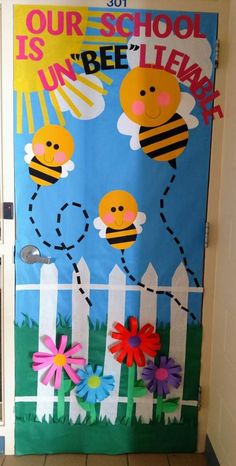 a door decorated to look like a bee with flowers on the front and back side