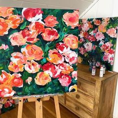 an easel with flowers painted on it