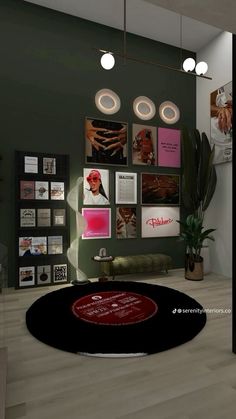 a living room with green walls and pictures on the wall, round rug in front of it