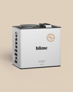 a white can with the word blime on it and a clock in the middle