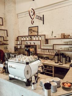 a coffee shop filled with lots of cups