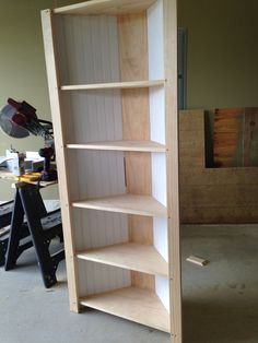 an unfinished bookcase in the process of being built