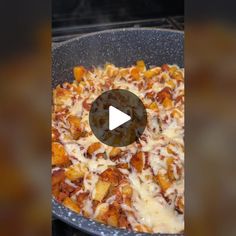 a pan filled with food sitting on top of a stove