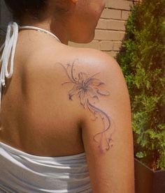 a woman with a tattoo on her back