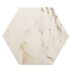 a white marble hexagonal tile on a white background