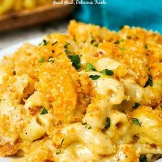 macaroni and cheese casserole on a white plate with parmesan