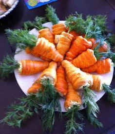 carrots are arranged on a plate with parsley