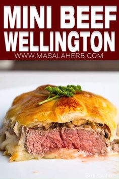 a close up of food on a plate with text overlay that reads mini beef wellington