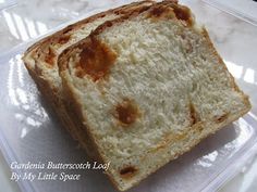 two pieces of bread sitting on top of a plastic container